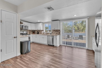 Welcome to this beautifully updated three-bedroom, two-bath home on Paradise Valley Park Golf Course in Arizona - for sale on GolfHomes.com, golf home, golf lot