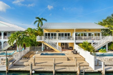 Welcome to this inviting east facing, waterfront, stilted half on Key Colony Beach Golf Course in Florida - for sale on GolfHomes.com, golf home, golf lot