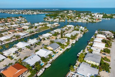 Welcome to this inviting east facing, waterfront, stilted half on Key Colony Beach Golf Course in Florida - for sale on GolfHomes.com, golf home, golf lot