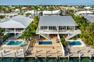 Welcome to this inviting east facing, waterfront, stilted half on Key Colony Beach Golf Course in Florida - for sale on GolfHomes.com, golf home, golf lot