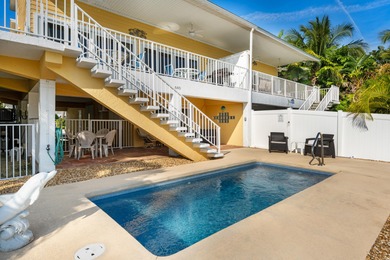 Welcome to this inviting east facing, waterfront, stilted half on Key Colony Beach Golf Course in Florida - for sale on GolfHomes.com, golf home, golf lot
