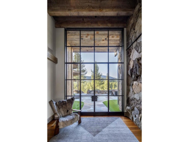Perched on a basaltic ledge with panoramic views of creek on Martis Camp Golf Course in California - for sale on GolfHomes.com, golf home, golf lot