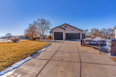 Enter this lovely home through the private courtyard to the on Desert Hawk At Pueblo West in Colorado - for sale on GolfHomes.com, golf home, golf lot