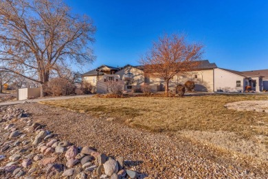 Enter this lovely home through the private courtyard to the on Desert Hawk At Pueblo West in Colorado - for sale on GolfHomes.com, golf home, golf lot