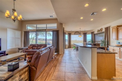 Imagine stepping into a stunning 3 bedroom 2 bath home nestled on Laughlin Ranch Golf Club in Arizona - for sale on GolfHomes.com, golf home, golf lot