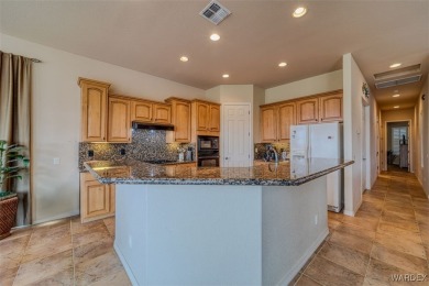 Imagine stepping into a stunning 3 bedroom 2 bath home nestled on Laughlin Ranch Golf Club in Arizona - for sale on GolfHomes.com, golf home, golf lot