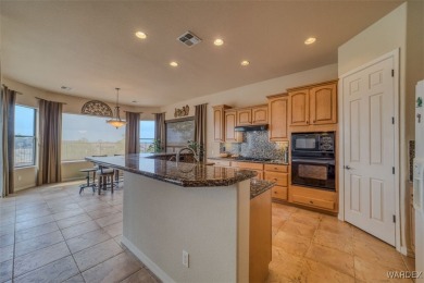 Imagine stepping into a stunning 3 bedroom 2 bath home nestled on Laughlin Ranch Golf Club in Arizona - for sale on GolfHomes.com, golf home, golf lot