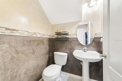 A welcoming blend of style, expertly designed space, and peace on Stoneybrook East Golf Club in Florida - for sale on GolfHomes.com, golf home, golf lot