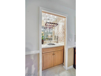 Turnkey, top-floor condo ideal for seasonal living or rental on Kelly Greens Golf and Country Club in Florida - for sale on GolfHomes.com, golf home, golf lot