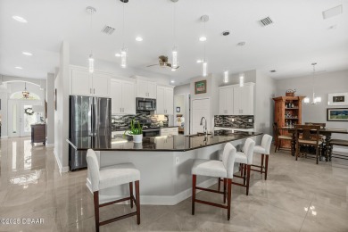 Experience a life of unparalleled luxury and serenity. This on Plantation Bay Golf and Country Club in Florida - for sale on GolfHomes.com, golf home, golf lot