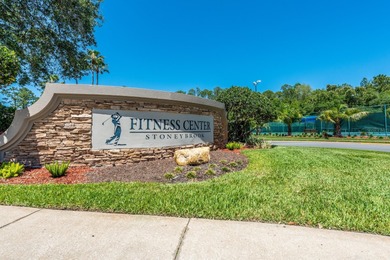 A welcoming blend of style, expertly designed space, and peace on Stoneybrook East Golf Club in Florida - for sale on GolfHomes.com, golf home, golf lot