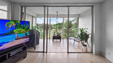 Experience the charm of Palm Aire in this beautifully updated on Palm-Aire Country Club and Resort - The Oaks in Florida - for sale on GolfHomes.com, golf home, golf lot
