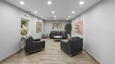 Experience the charm of Palm Aire in this beautifully updated on Palm-Aire Country Club and Resort - The Oaks in Florida - for sale on GolfHomes.com, golf home, golf lot
