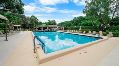 Experience the charm of Palm Aire in this beautifully updated on Palm-Aire Country Club and Resort - The Oaks in Florida - for sale on GolfHomes.com, golf home, golf lot