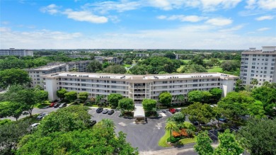 Experience the charm of Palm Aire in this beautifully updated on Palm-Aire Country Club and Resort - The Oaks in Florida - for sale on GolfHomes.com, golf home, golf lot