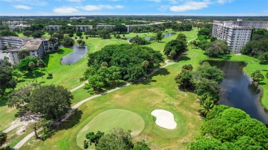 Experience the charm of Palm Aire in this beautifully updated on Palm-Aire Country Club and Resort - The Oaks in Florida - for sale on GolfHomes.com, golf home, golf lot