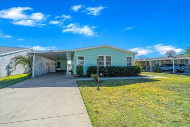 Wake up every day to peaceful water views and easy Florida on Plantation Golf Club in Florida - for sale on GolfHomes.com, golf home, golf lot