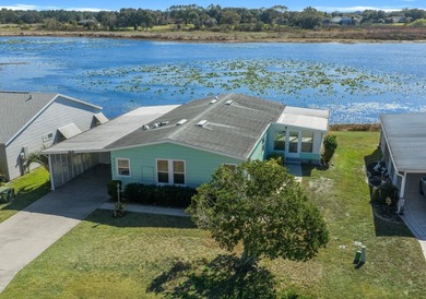 Wake up every day to peaceful water views and easy Florida on Plantation Golf Club in Florida - for sale on GolfHomes.com, golf home, golf lot