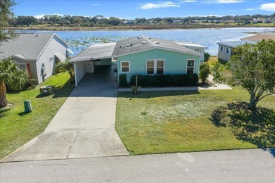 Wake up every day to peaceful water views and easy Florida on Plantation Golf Club in Florida - for sale on GolfHomes.com, golf home, golf lot