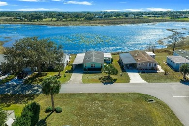 Wake up every day to peaceful water views and easy Florida on Plantation Golf Club in Florida - for sale on GolfHomes.com, golf home, golf lot