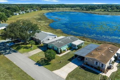 Wake up every day to peaceful water views and easy Florida on Plantation Golf Club in Florida - for sale on GolfHomes.com, golf home, golf lot