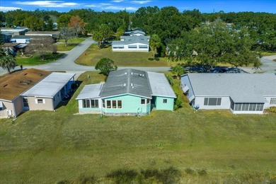 Wake up every day to peaceful water views and easy Florida on Plantation Golf Club in Florida - for sale on GolfHomes.com, golf home, golf lot