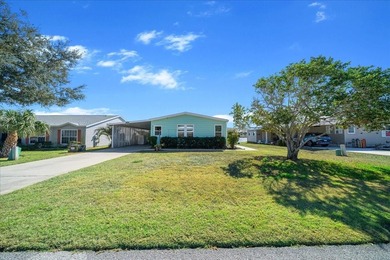 Wake up every day to peaceful water views and easy Florida on Plantation Golf Club in Florida - for sale on GolfHomes.com, golf home, golf lot