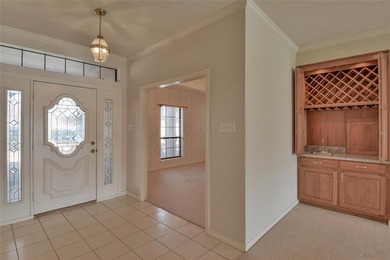 This one-owner 3-2-2 brick home sits on 1.8 acres of land that on Pecan Plantation Country Club in Texas - for sale on GolfHomes.com, golf home, golf lot