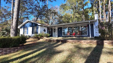 Beautiful home perched on a hill overlooking a scenic view of on Hide-A-Way Lake Golf Course in Texas - for sale on GolfHomes.com, golf home, golf lot