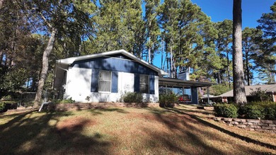 Beautiful home perched on a hill overlooking a scenic view of on Hide-A-Way Lake Golf Course in Texas - for sale on GolfHomes.com, golf home, golf lot