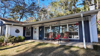 Beautiful home perched on a hill overlooking a scenic view of on Hide-A-Way Lake Golf Course in Texas - for sale on GolfHomes.com, golf home, golf lot