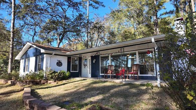 Beautiful home perched on a hill overlooking a scenic view of on Hide-A-Way Lake Golf Course in Texas - for sale on GolfHomes.com, golf home, golf lot
