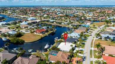 EXPERIENCE PANORAMIC WIDE BASIN & ENDLESS INTERSECTING CANAL on Saint Andrews South Golf Club in Florida - for sale on GolfHomes.com, golf home, golf lot