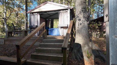 Beautiful home perched on a hill overlooking a scenic view of on Hide-A-Way Lake Golf Course in Texas - for sale on GolfHomes.com, golf home, golf lot