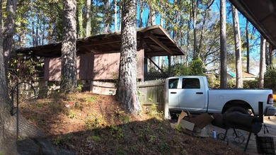 Beautiful home perched on a hill overlooking a scenic view of on Hide-A-Way Lake Golf Course in Texas - for sale on GolfHomes.com, golf home, golf lot
