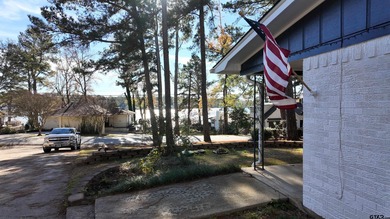 Beautiful home perched on a hill overlooking a scenic view of on Hide-A-Way Lake Golf Course in Texas - for sale on GolfHomes.com, golf home, golf lot