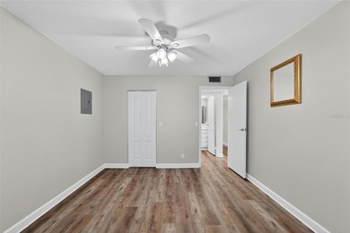 This bright condo features a living room-dining room combination on Sandpiper Golf Club in Florida - for sale on GolfHomes.com, golf home, golf lot
