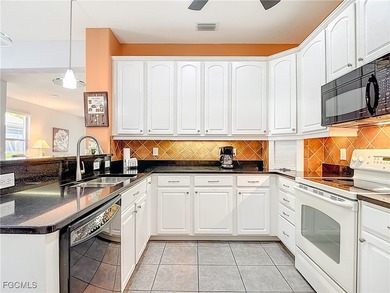 This sunny END UNIT attached villa in HERONS GLEN COUNTRY CLUB's on Herons Glen Golf and Country Club in Florida - for sale on GolfHomes.com, golf home, golf lot