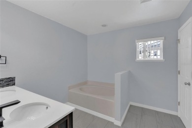 Renovated and stunning 4-bedroom, 2-bath pool home offers the on Royal St. Cloud Golf Links in Florida - for sale on GolfHomes.com, golf home, golf lot