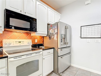 This sunny END UNIT attached villa in HERONS GLEN COUNTRY CLUB's on Herons Glen Golf and Country Club in Florida - for sale on GolfHomes.com, golf home, golf lot