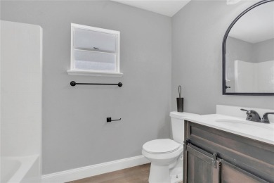 Renovated and stunning 4-bedroom, 2-bath pool home offers the on Royal St. Cloud Golf Links in Florida - for sale on GolfHomes.com, golf home, golf lot