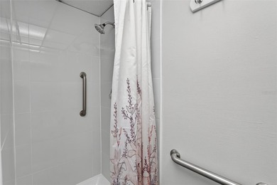 This bright condo features a living room-dining room combination on Sandpiper Golf Club in Florida - for sale on GolfHomes.com, golf home, golf lot