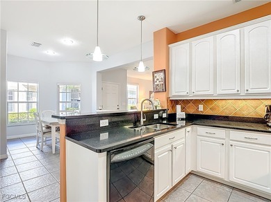 This sunny END UNIT attached villa in HERONS GLEN COUNTRY CLUB's on Herons Glen Golf and Country Club in Florida - for sale on GolfHomes.com, golf home, golf lot