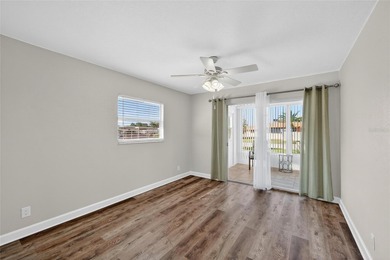 This bright condo features a living room-dining room combination on Sandpiper Golf Club in Florida - for sale on GolfHomes.com, golf home, golf lot