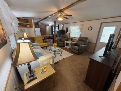 Beautifully furnished 2 bedroom, 2 bath home featuring a on Lake Henry Golf Club in Florida - for sale on GolfHomes.com, golf home, golf lot