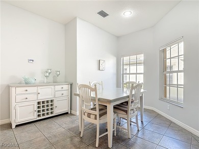 This sunny END UNIT attached villa in HERONS GLEN COUNTRY CLUB's on Herons Glen Golf and Country Club in Florida - for sale on GolfHomes.com, golf home, golf lot