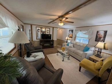 Beautifully furnished 2 bedroom, 2 bath home featuring a on Lake Henry Golf Club in Florida - for sale on GolfHomes.com, golf home, golf lot