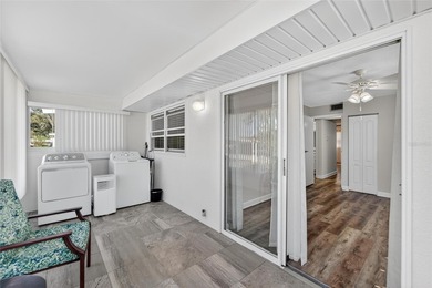 This bright condo features a living room-dining room combination on Sandpiper Golf Club in Florida - for sale on GolfHomes.com, golf home, golf lot