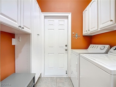 This sunny END UNIT attached villa in HERONS GLEN COUNTRY CLUB's on Herons Glen Golf and Country Club in Florida - for sale on GolfHomes.com, golf home, golf lot