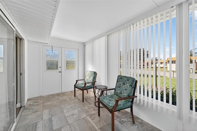 This bright condo features a living room-dining room combination on Sandpiper Golf Club in Florida - for sale on GolfHomes.com, golf home, golf lot